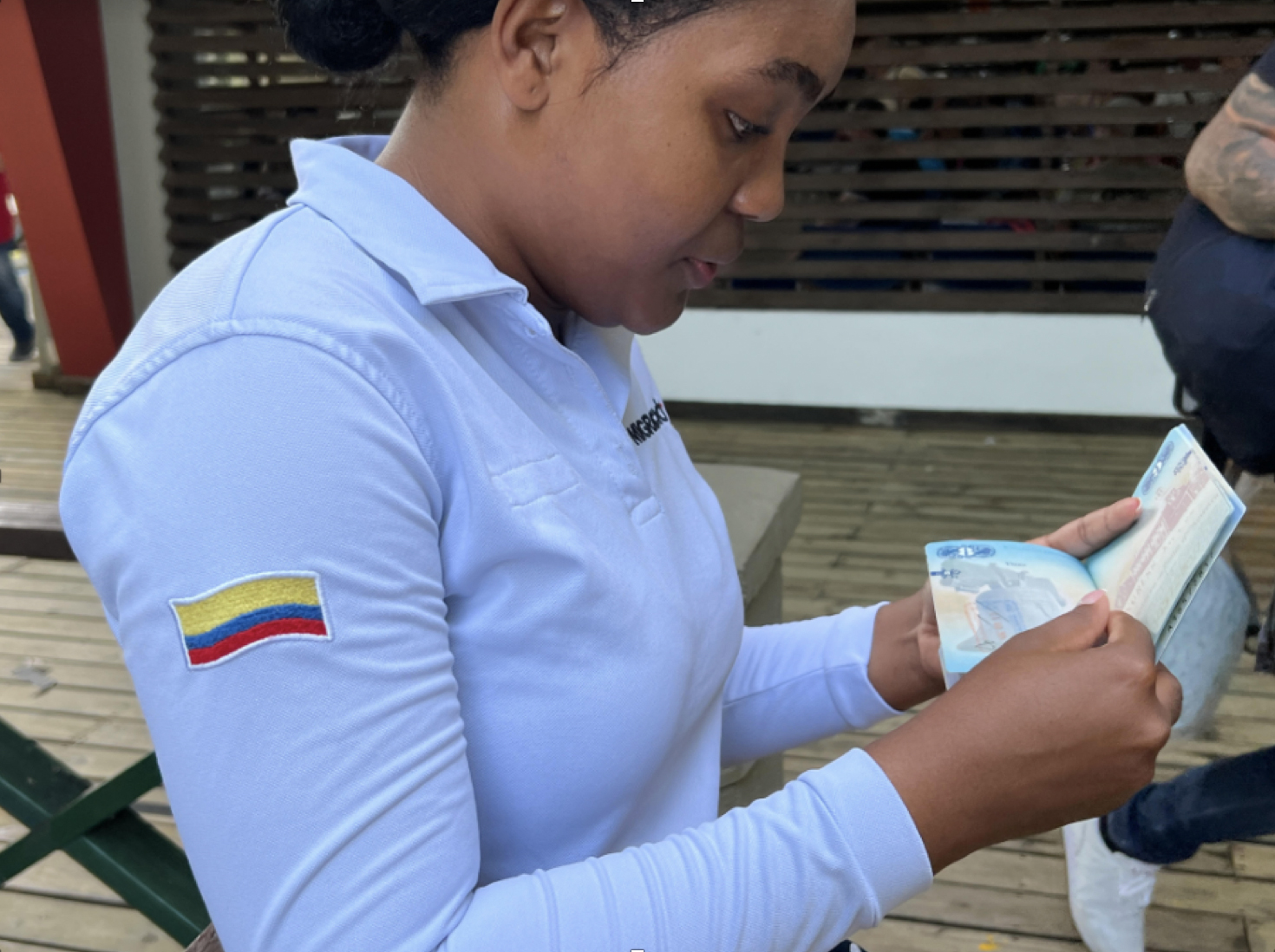 A Colombian migration officer checks the author's passport and all identity papers before allowing immigrants to board vessels crossing the Gulf of Uraba